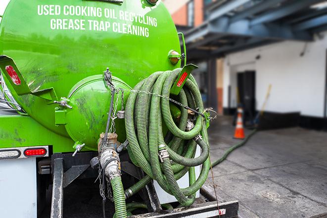 a pump truck emptying a grease trap in Clarksburg